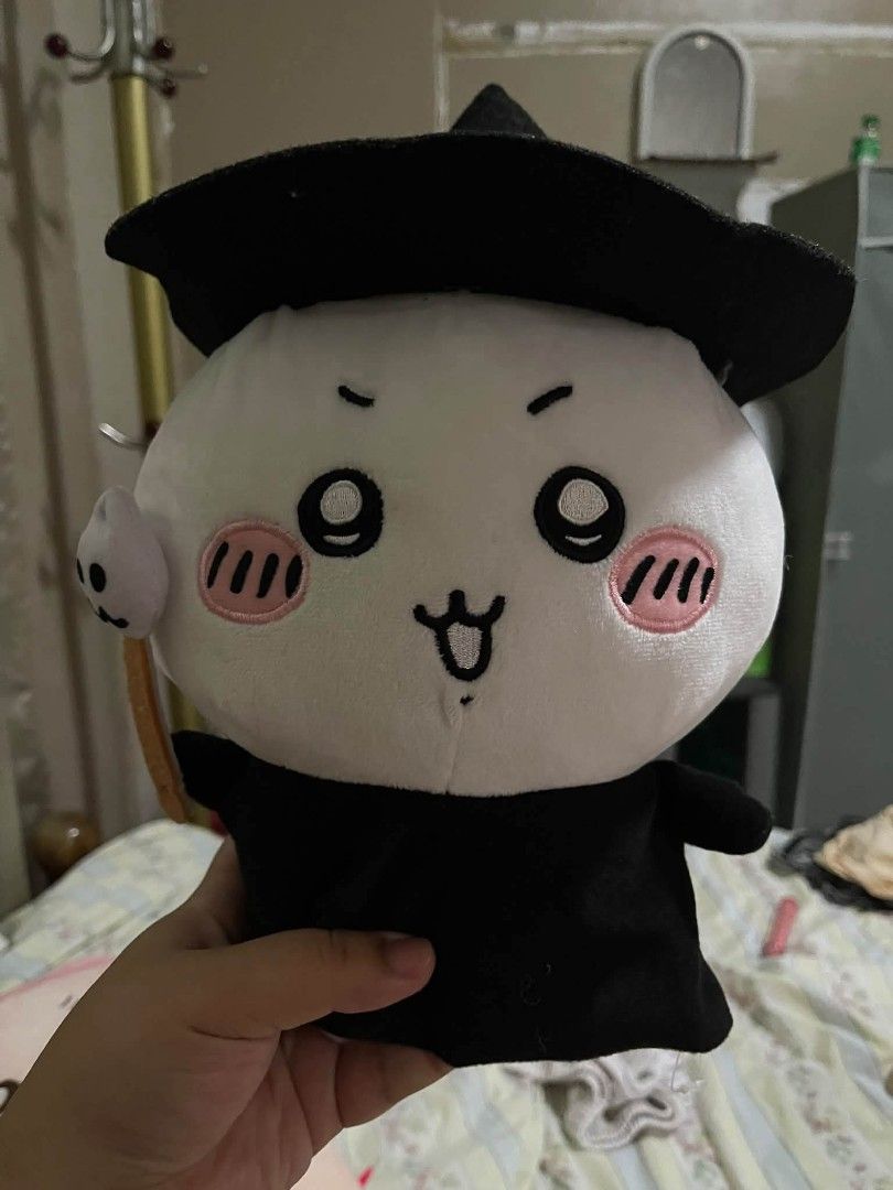 Chiikawa Witch Plush Toy (Category: Plushies & Soft Toys) located in Bacolod City. Submitted by mariowos (Listing ID 1466064739, Image 1). Description: - Character: Chiikawa in a wizard outfit - Details: Wearing a black wizard hat and robe with embroidered face and pink cheeks - Condition: Clean, well-kept, and official tag attached near the back - Material: Soft white and black fabric.