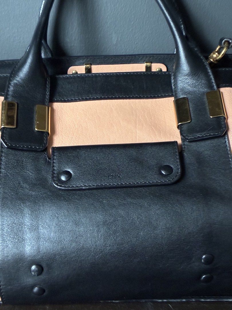 Chloé Alice Two-Tone Leather Satchel (Category: Luxury Bags & Wallets) located in Pasig City. Submitted by alvinthedecluttererist (Listing ID 1466024460, Image 2). Description: - Authentic Chloé Alice handbag in black and light pink leather - Elegant gold-tone hardware and front slip pocket with Chloé logo stamp - Structured double top handles plus a detachable strap for versatile wear - Secure zip top closure with a spacious fabric-lined interio