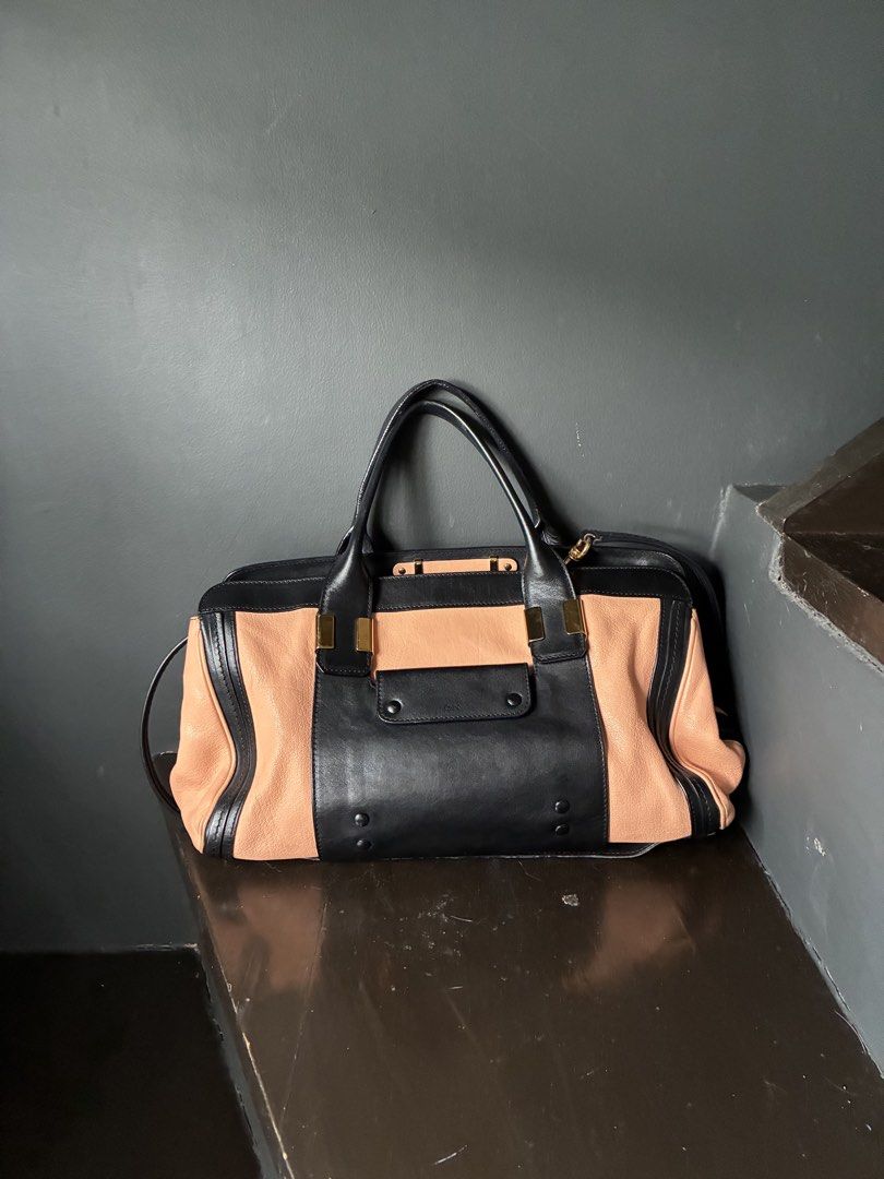 Chloé Alice Two-Tone Leather Satchel (Category: Luxury Bags & Wallets) located in Pasig City. Submitted by alvinthedecluttererist (Listing ID 1466024460, Image 1). Description: - Authentic Chloé Alice handbag in black and light pink leather - Elegant gold-tone hardware and front slip pocket with Chloé logo stamp - Structured double top handles plus a detachable strap for versatile wear - Secure zip top closure with a spacious fabric-lined interio
