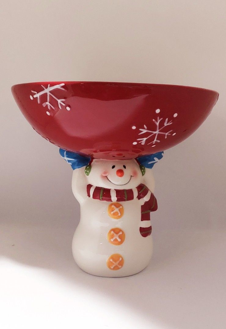 Christmas Snowman Candy Bowl Festive Table Decor (Category: Vases & Decorative Bowls) located in Cainta. Submitted by veronica2277 (Listing ID 1466054923, Image 1). Description: - Festive snowman candy bowl and holiday centerpiece - Snowman design features a striped winter scarf, blue mittens, and orange button details - Holds a red and white peppermint-striped bowl with painted white snowflakes - Made of clean, high-quality ceramic finish all ar