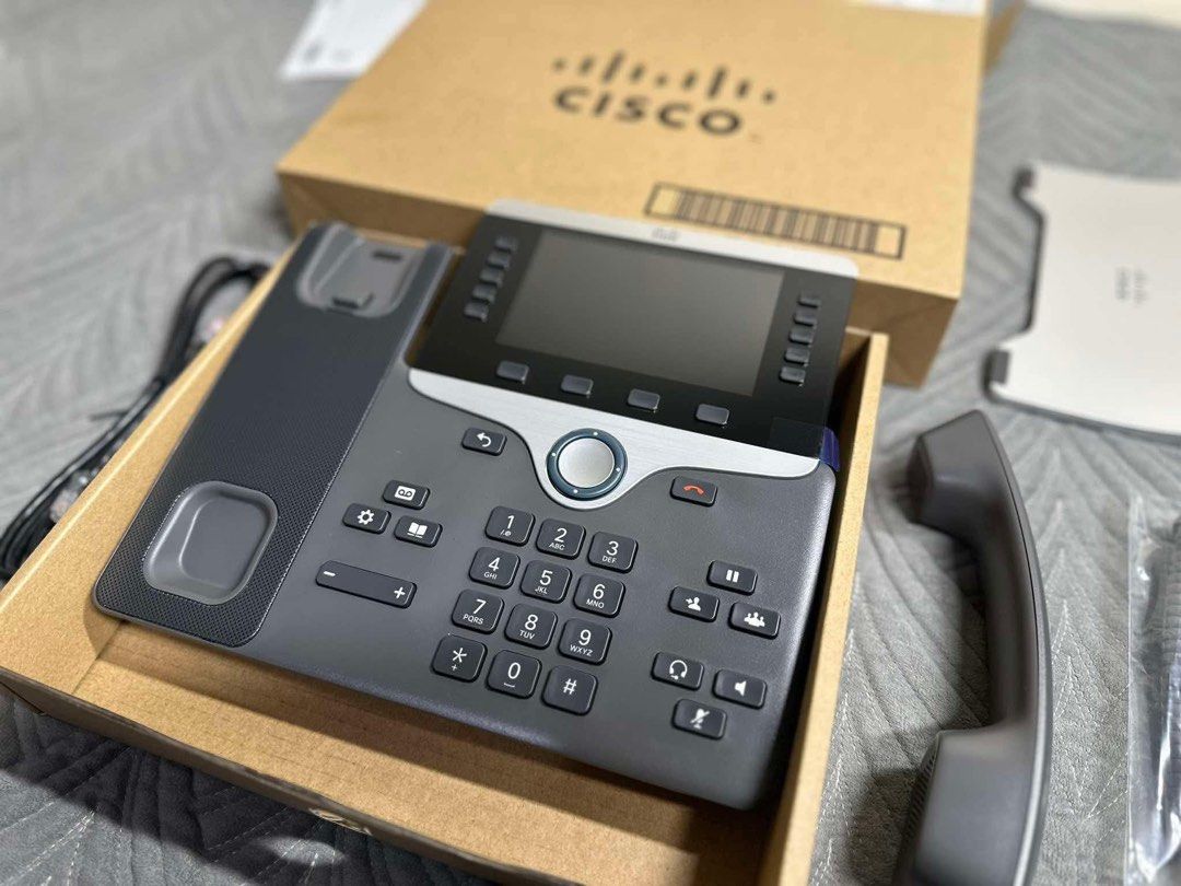 Cisco IP Phone with Display Screen and Handset (Category: Office & Business Technology) located in Manila. Submitted by bacsaljose40805 (Listing ID 1466027215, Image 2). Description: - Features a large color display screen, keypad, and programmable line buttons - Powers on successfully with the Cisco logo visible on screen - Comes complete with the original handset and branded packaging box - Ideal upgrade for your office, home office, or remote 