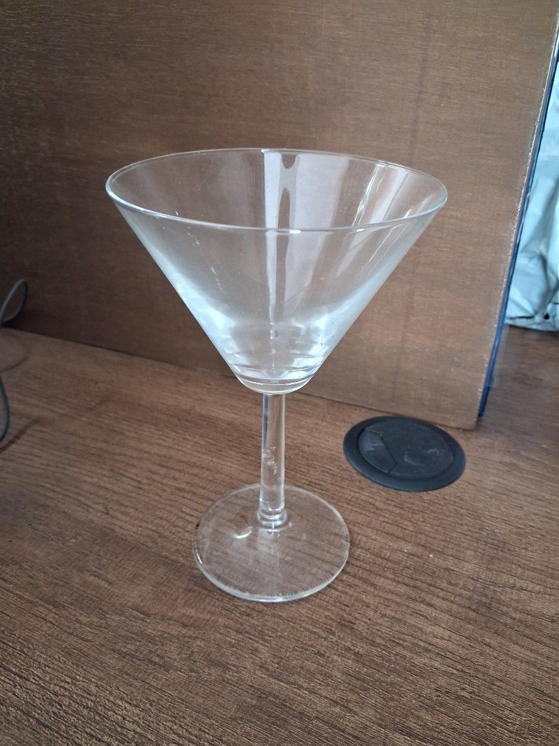 Clear Martini Glass with Stem (Category: Other Kitchenware & Tableware) located in Taguig. Submitted by ssvcn (Listing ID 1465967563, Image 3). Description: - Classic martini glass design - Made of clear, durable glass - Sturdy stem and base for stability - Ideal for cocktails, parties, or home bar decor - Dishwasher safe for easy cleaning.