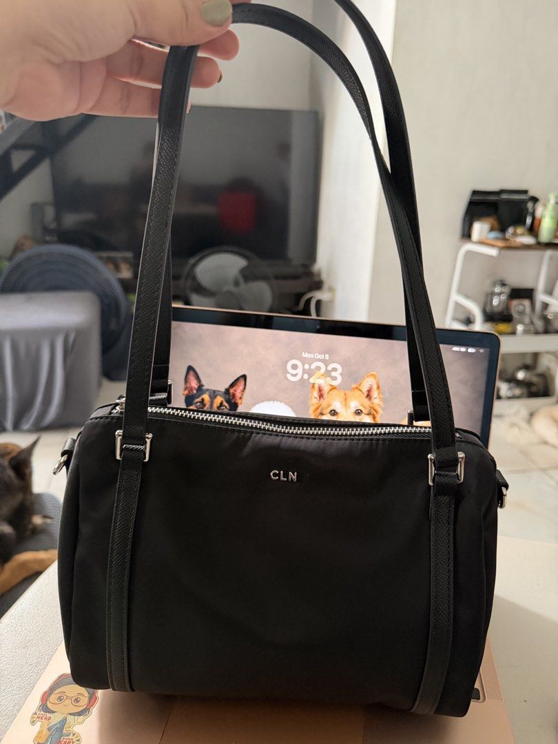CLN Mandy Black Nylon Handbag (Category: Shoulder Bags) located in Tanza. Submitted by shopatbrandsandstuff (Listing ID 1465961724, Image 3). Description: - Brand: CLN Mandy - Color: Black nylon with striking silver hardware and front logo lettering - Versatile carry: Double top handles and a detachable, adjustable crossbody strap - Storage: Main zippered compartment plus a handy external back zippered pocket - Structure: Clean, structured base t