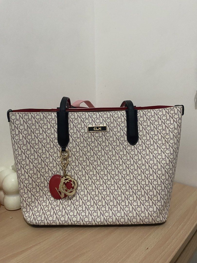 CLN monogram tote bag with red interior and charm (Category: Tote Bags) located in Manila. Submitted by stormiegray (Listing ID 1465981719, Image 2). Description: - Brand: CLN - Design: Monogram print with chic black and red colorway - Straps: Black shoulder straps with contrasting red backing - Closure: Secure zipped main compartment - Interior: Red fabric lining with convenient zipped and slip pockets - Hardware: Premium gold-toned hardware and