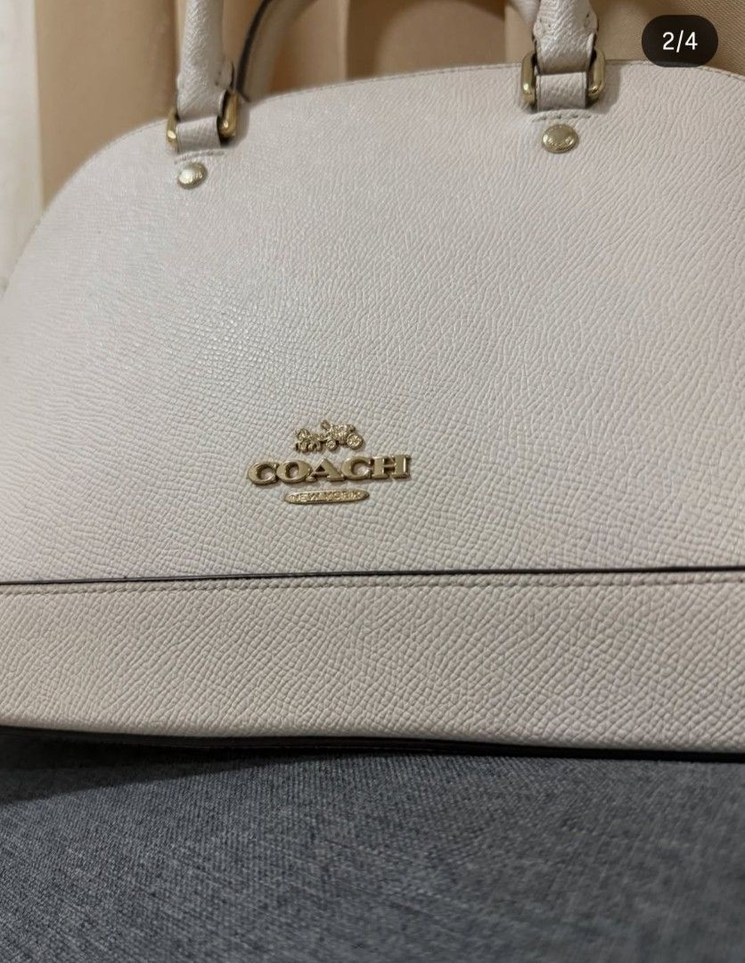 Coach bag (Category: Cross-body Bags) located in Naic. Submitted by niqssss (Listing ID 1466106149, Image 3). Description: preloved coach with signs of usage charms and hangtag not included those are my personal items. thanks.
