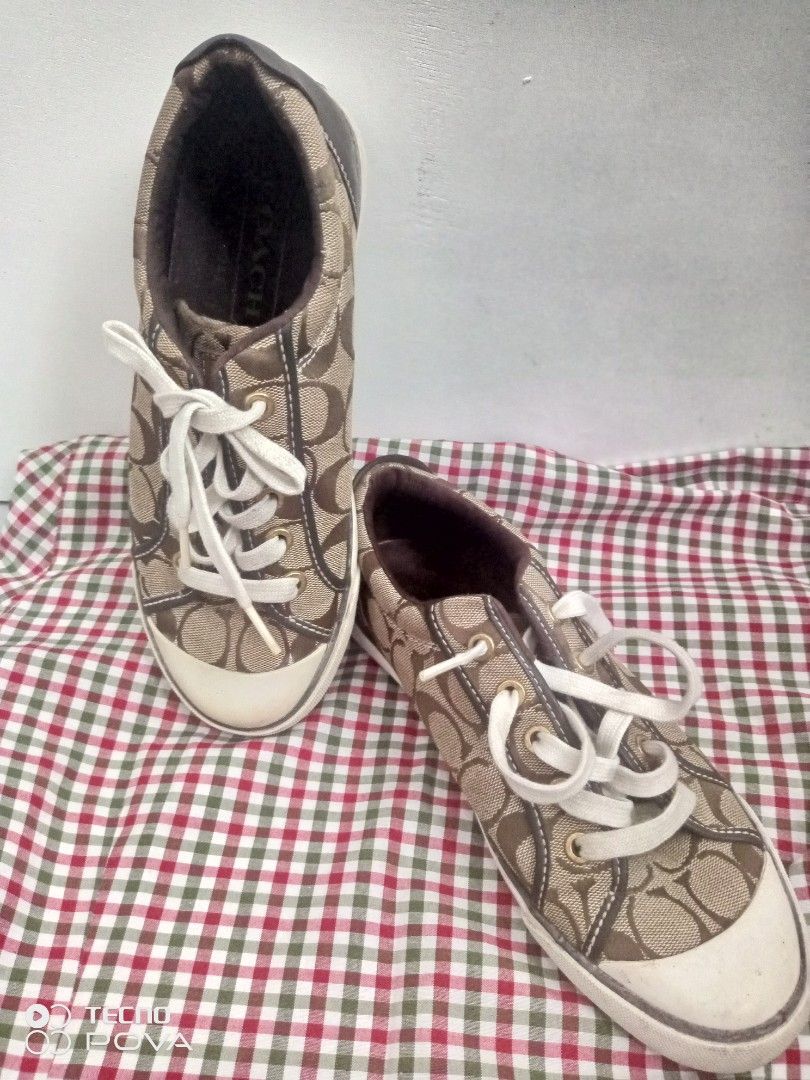 Canvas Sneaker Brown Size 8M (Category: Sneakers) located in Imus. Submitted by yabzchelle (Listing ID 1466146332, Image 1). Description: sneakers in brown signature monogram canvas, size 38 Features white laces, white toe caps, and brown leather accents. Clean condition with minor wear on the soles. Perfect for casual everyday wear. Grab these stylish kicks today!.