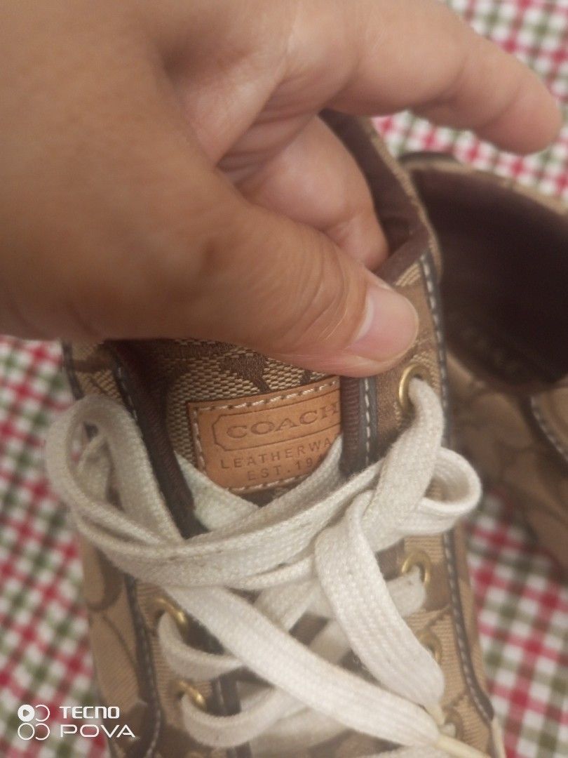 Canvas Sneaker Brown Size 8M (Category: Sneakers) located in Imus. Submitted by yabzchelle (Listing ID 1466146332, Image 2). Description: sneakers in brown signature monogram canvas, size 38 Features white laces, white toe caps, and brown leather accents. Clean condition with minor wear on the soles. Perfect for casual everyday wear. Grab these stylish kicks today!.