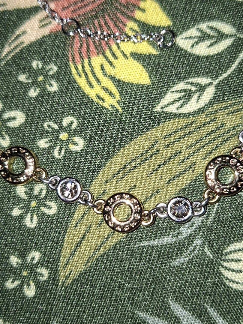COACH F56412 Circle Necklace (Category: Necklaces) located in Manila. Submitted by mialiurshop (Listing ID 1465991039, Image 3). Description: - Authentic Coach necklace with striking interlocking circle pendant - Sparkling crystal details for an elegant touch - Trendy alternating silver and gold-tone chain links - Adjustable chain length with a secure lobster clasp closure - Includes original branded Coach box and store receipt from Off House.