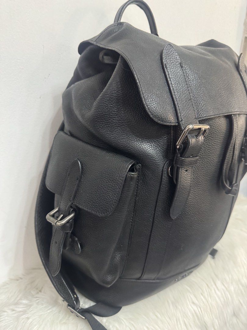 Coach Hudson Backpack (Category: Backpacks) located in Malolos. Submitted by urban_thrift_09 (Listing ID 1466027272, Image 3). Description: -Coach Hudson Backpack in black natural pebble leather. -Flap and drawstring main closure, dual buckled straps, exterior side flap pockets, top grab handle, and an internal tech/laptop sleeve. -Black natural pebble leather with gunmetal-tone hardware -Made in Philippines -Details in photos.