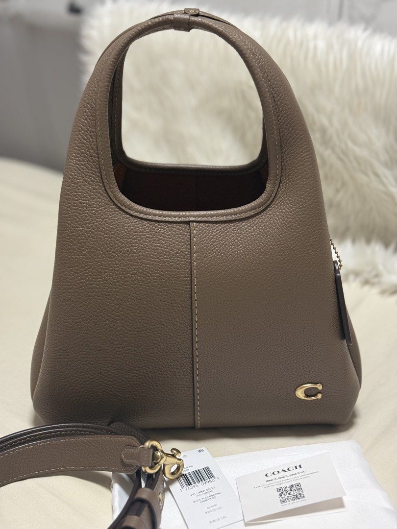 Coach Lana 23 in dark stone (Category: Luxury Bags & Wallets) located in Pasig City. Submitted by akmonlineboutique (Listing ID 1466060422, Image 1). Description: Preloved like new condition used once only apakaganda in ferson😍 comes with tag, dust bag 💯Original from 🇨🇦 📍Pasig loc Pass sa barat✌🏼 .