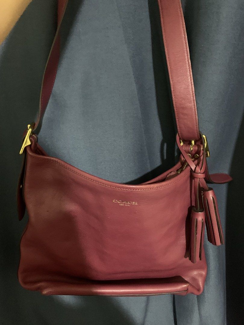 Coach Leather Shoulder Bag Burgundy (Category: Luxury Bags & Wallets) located in Bulacan. Submitted by celinexxxbuyer (Listing ID 1466131594, Image 1). Description: - Brand: Coach - Style: Leather shoulder bag in a rich burgundy color - Hardware & Accents: Gold-tone hardware with matching tassels - Closure: Top zip closure - Interior: Fabric lining with one zipper pocket and slip pockets - Authenticity: Coach creed patch with serial number C1375-