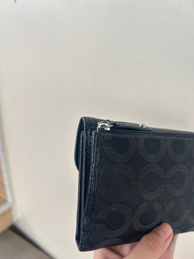 Coach Madison Op Art Medium Wallet in black with box (Category: Luxury Bags & Wallets) located in Ilagan. Submitted by mysticdolphin.dfdd31 (Listing ID 1466072453, Image 2). Description: ✨ **Condition:** Good condition 🎨 **Details:** Repainted, but the external part is still in good condition. 🔎 **Issue:** Minimal signs of use/imperfection, but nothing major. 💖 Still usable and presentable—perfect for everyday use! 📌 Please manage your expect
