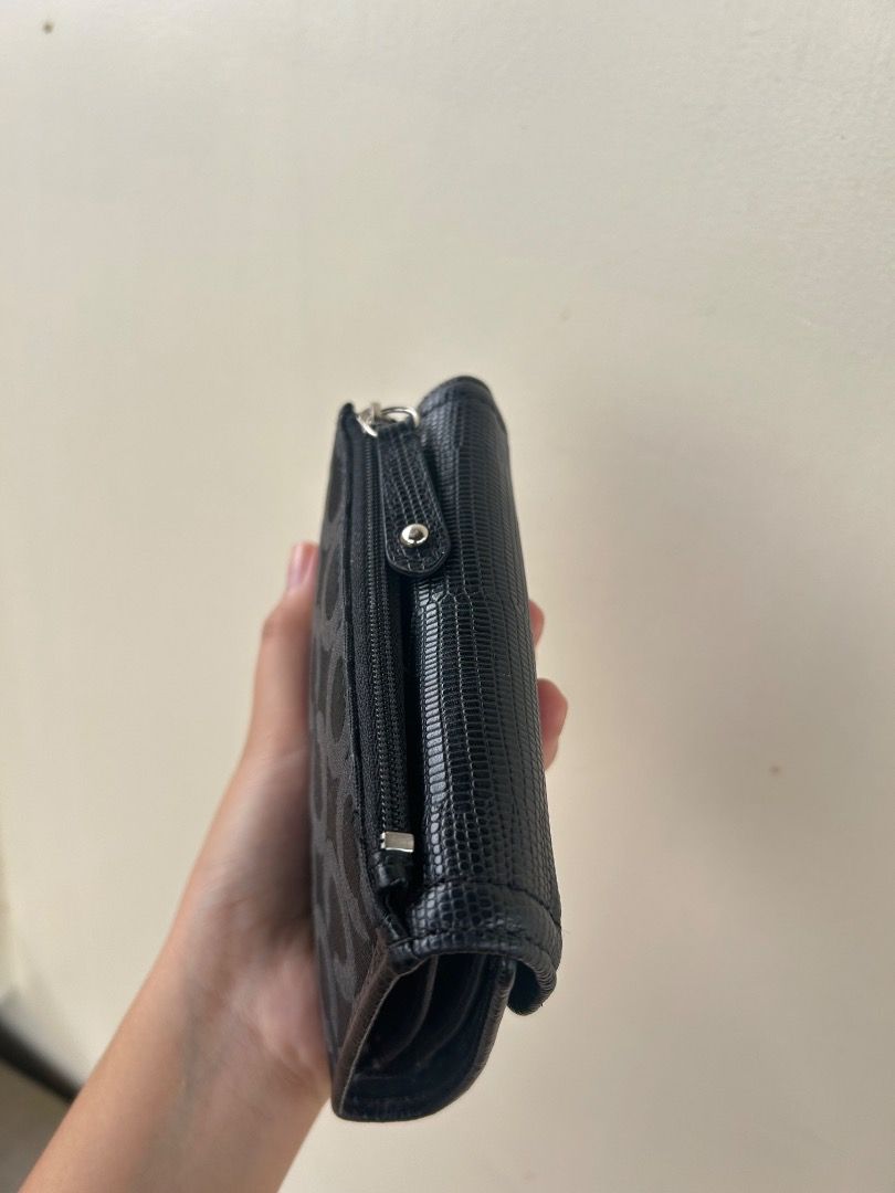 Coach Madison Op Art Medium Wallet in black with box (Category: Luxury Bags & Wallets) located in Ilagan. Submitted by mysticdolphin.dfdd31 (Listing ID 1466072453, Image 3). Description: ✨ **Condition:** Good condition 🎨 **Details:** Repainted, but the external part is still in good condition. 🔎 **Issue:** Minimal signs of use/imperfection, but nothing major. 💖 Still usable and presentable—perfect for everyday use! 📌 Please manage your expect
