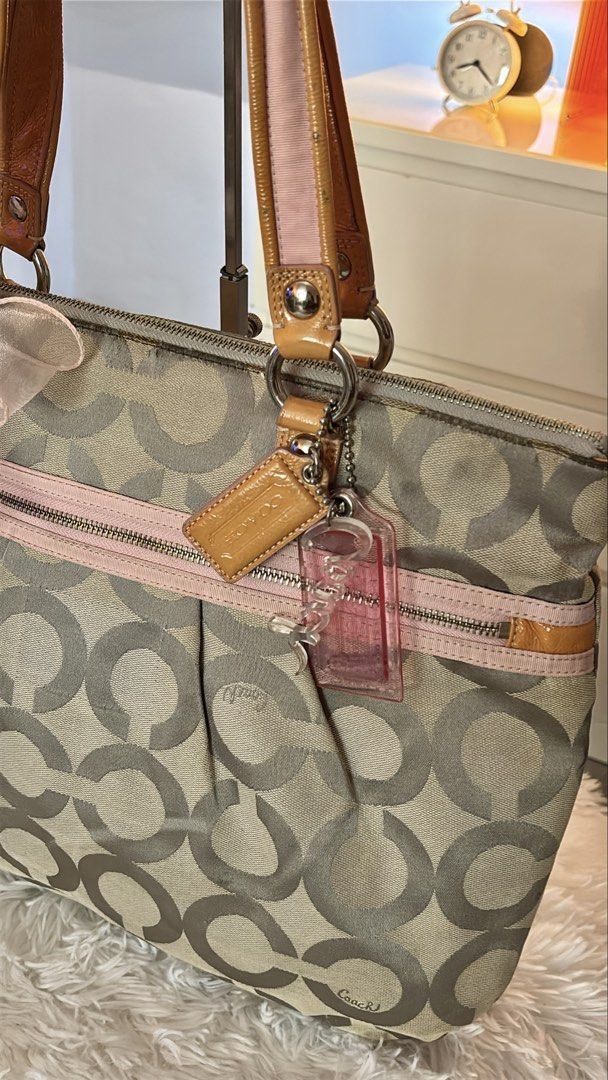 Coach Pink Poppy Bag - complete hangtag (Category: Luxury Bags & Wallets) located in Cavite. Submitted by helpdeclutterthisgirl (Listing ID 1466085974, Image 2). Description: Coach Poppy Shoulder Bag 🏷️ ₱ 2,499 - guaranteed authentic - with complete 3 hangtag - clean interior - good condition - clean canvas - normal sign of usage - crack creed only last photo.