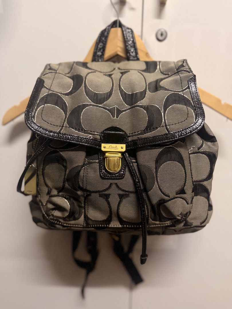 Coach Signature C Black Grey Jacquard Backpack (Category: Backpacks) located in Zamboanga. Submitted by bags2bags2bags (Listing ID 1465981682, Image 1). Description: - Authentic Coach signature C jacquard backpack in classic black and grey tones - Stylish glossy black patent leather trim on the flap, straps, and drawstring - Elegant gold-tone hardware with a secure front turn-lock closure - Roomy main compartment featuring a convenient drawstring