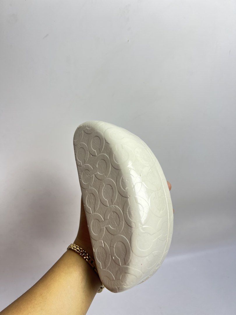Coach signature C white hard shell sunglasses eyeglasses case (Category: Sunglasses & Eyewear) located in Baguio. Submitted by chiechie1234 (Listing ID 1466071237, Image 3). Description: - Coach hard shell glasses case - White exterior with iconic debossed signature C pattern - Luxurious brown suede interior lining with Coach Est. 1941 stamp - Secure and reliable magnetic snap closure - Excellent for keeping shades or specs safe in your bag - Con
