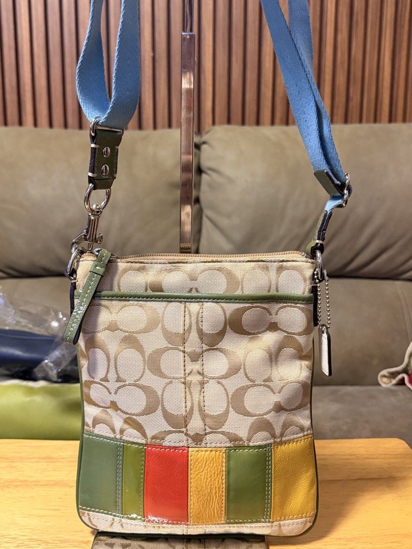 Coach Signature Stripe Patchwork Crossbody Bag (Category: Cross-body Bags) located in Zamboanga. Submitted by bags2bags2bags (Listing ID 1465984320, Image 1). Description: - Authentic Coach crossbody bag - Signature C monogram fabric with colorful leather panels and light green trim - Bright blue adjustable fabric strap - Reverse side features beige textured leather with a vertical white stripe and metallic Coach medallion - Secure top zipper clo