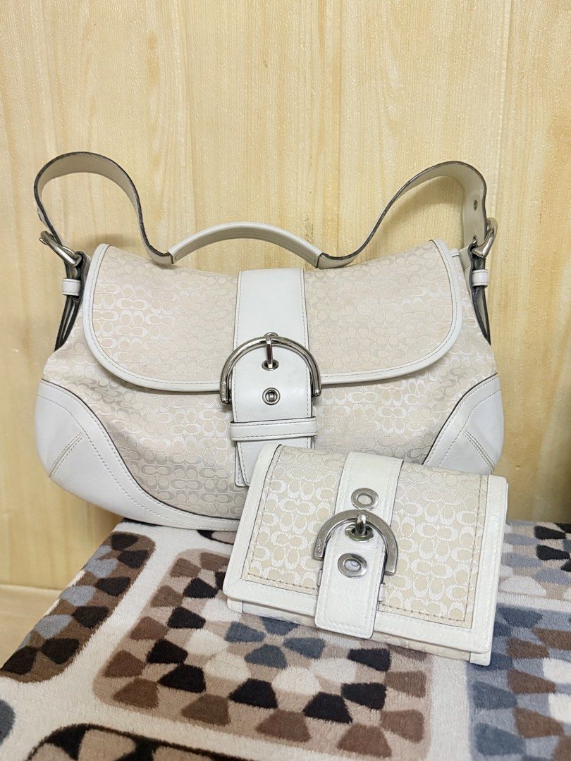 Coach Soho Set free WALLET (Category: Luxury Bags & Wallets) located in Manila. Submitted by angelcurated (Listing ID 1465975112, Image 1). Description: - Authentic Coach shoulder bag and matching wallet set - White signature C monogram canvas with white leather trim - Elegant silver-tone hardware and classic buckle closures - Comfortable shoulder strap for everyday wear - Practical size to fit all your daily essentials - Excellent, clean conditi