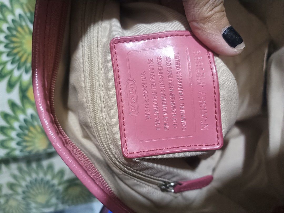 Coach tote bag (Category: Luxury Bags & Wallets) located in Cebu City. Submitted by elen30abalo (Listing ID 1462349351, Image 2). Description: - Authentic Coach satchel bag - Signature monogram print - Chic pink leather trim and handles - Detachable crossbody strap included - Elegant gold chain detail - Versatile for everyday or evening wear.