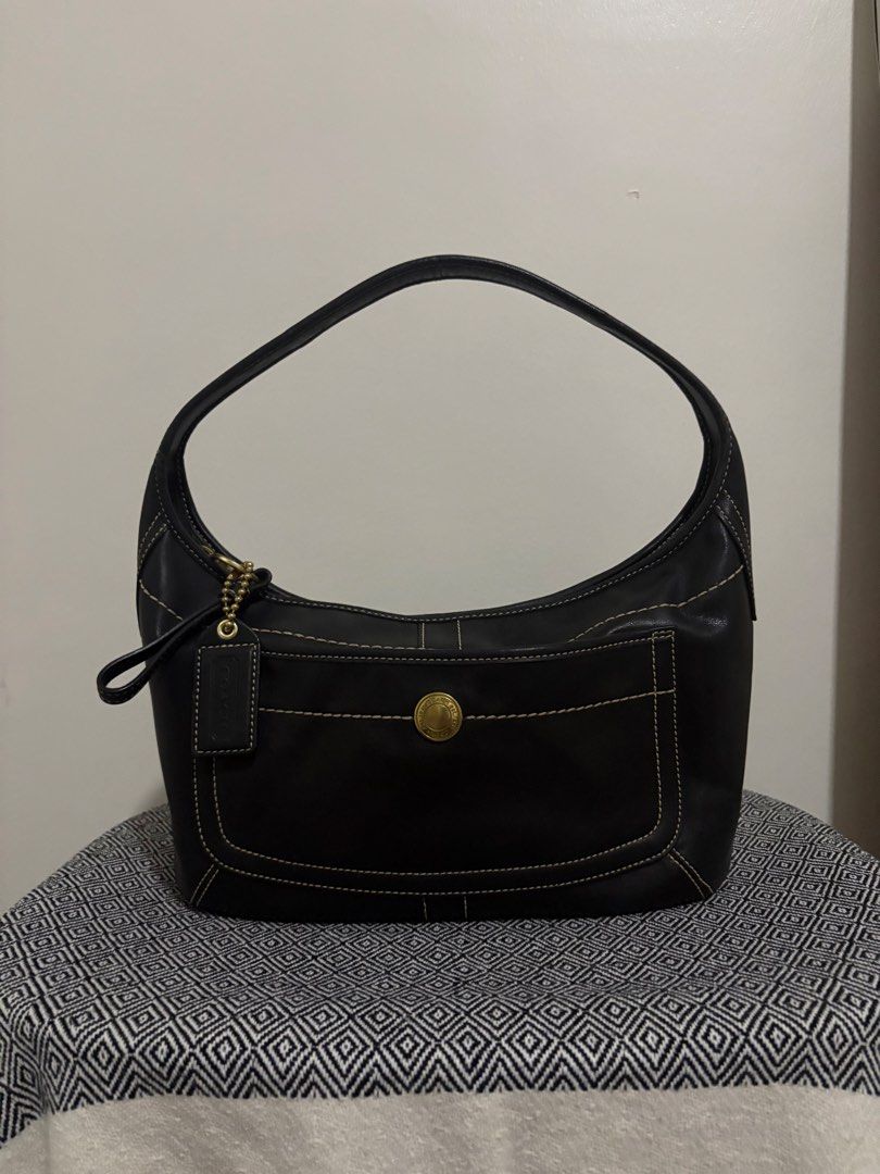 Coach Vintage Ergo Leather Shoulder Bag (Category: Luxury Bags & Wallets) located in Makati City. Submitted by allaineallaine (Listing ID 1466121449, Image 1). Description: - Brand: Coach - Model: Vintage Ergo Shoulder Bag (11283) - Color: Classic Black with contrast stitching - Material: Premium leather with durable fabric lining - Hardware: Gold-tone hardware with front turnlock pocket - Included: Original Coach leather hangtag - Condition: Exc
