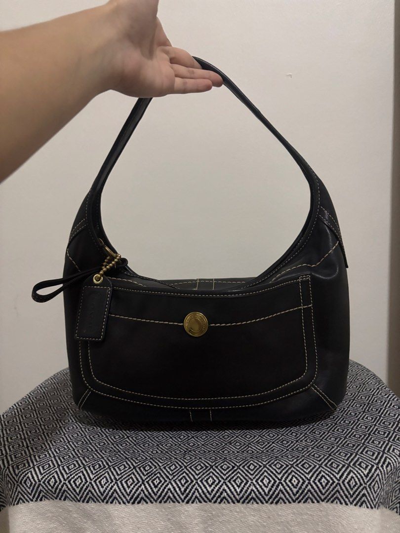 Coach Vintage Ergo Leather Shoulder Bag (Category: Luxury Bags & Wallets) located in Makati City. Submitted by allaineallaine (Listing ID 1466121449, Image 2). Description: - Brand: Coach - Model: Vintage Ergo Shoulder Bag (11283) - Color: Classic Black with contrast stitching - Material: Premium leather with durable fabric lining - Hardware: Gold-tone hardware with front turnlock pocket - Included: Original Coach leather hangtag - Condition: Exc