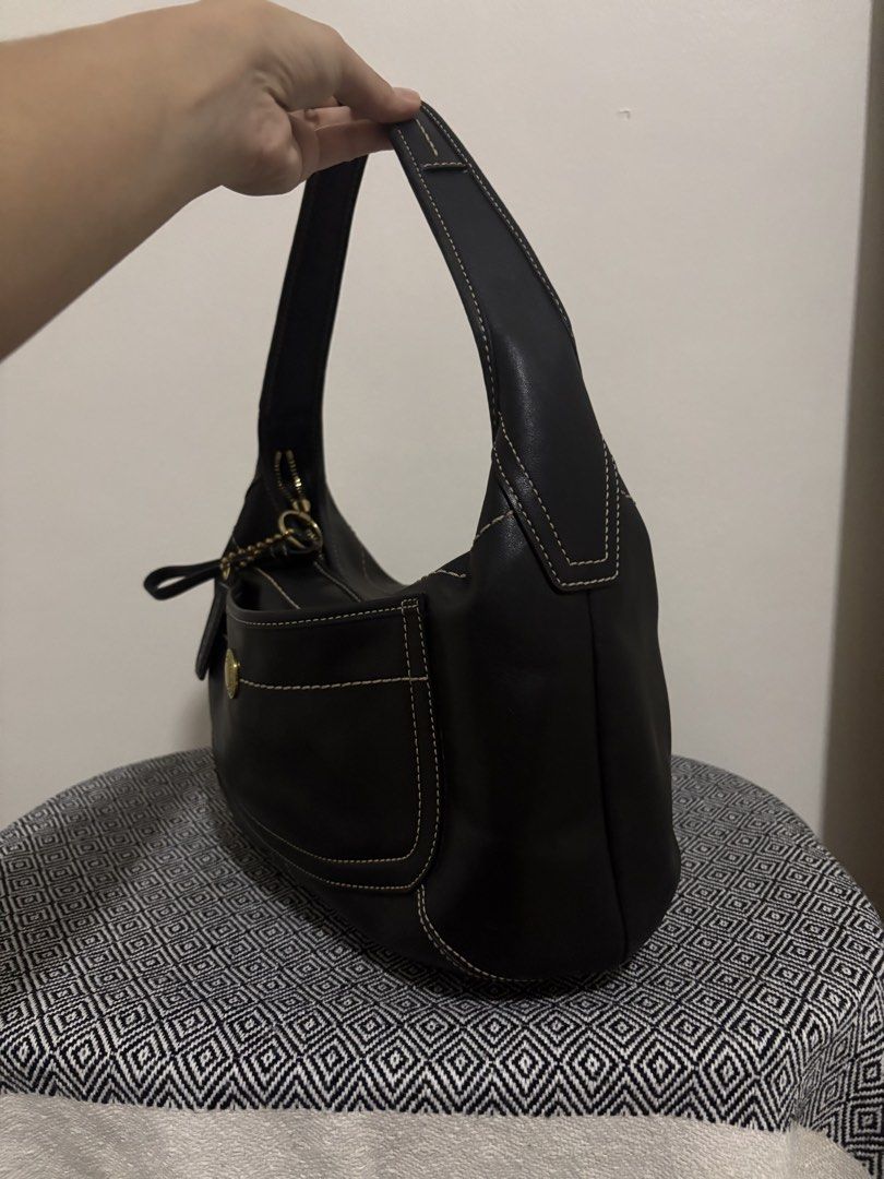 Coach Vintage Ergo Leather Shoulder Bag (Category: Luxury Bags & Wallets) located in Makati City. Submitted by allaineallaine (Listing ID 1466121449, Image 3). Description: - Brand: Coach - Model: Vintage Ergo Shoulder Bag (11283) - Color: Classic Black with contrast stitching - Material: Premium leather with durable fabric lining - Hardware: Gold-tone hardware with front turnlock pocket - Included: Original Coach leather hangtag - Condition: Exc