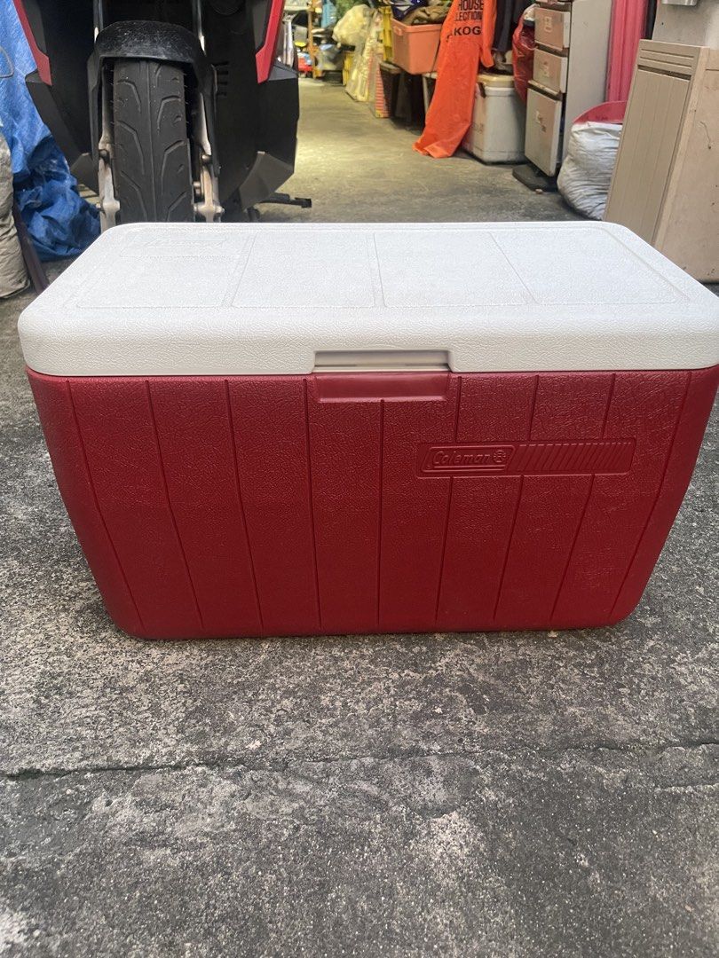 Coleman Red and White Large Cooler Box (Category: Food Organization & Storage) located in Manila. Submitted by chesterson1979. (Listing ID 1465961768, Image 1). Description: - Classic red and white Coleman design - Keeps drinks ice cold all day long - Built-in side handles for easy carrying - Convenient bottom corner drainage plug for quick emptying - Clean interior, ready for your next trip, tailgate, or beach day - Minor scuffs on handles from 