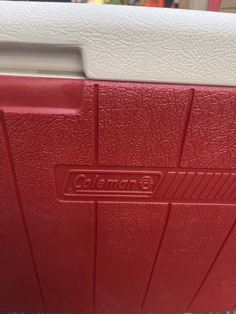 Coleman Red and White Large Cooler Box (Category: Food Organization & Storage) located in Manila. Submitted by chesterson1979. (Listing ID 1465961768, Image 2). Description: - Classic red and white Coleman design - Keeps drinks ice cold all day long - Built-in side handles for easy carrying - Convenient bottom corner drainage plug for quick emptying - Clean interior, ready for your next trip, tailgate, or beach day - Minor scuffs on handles from 