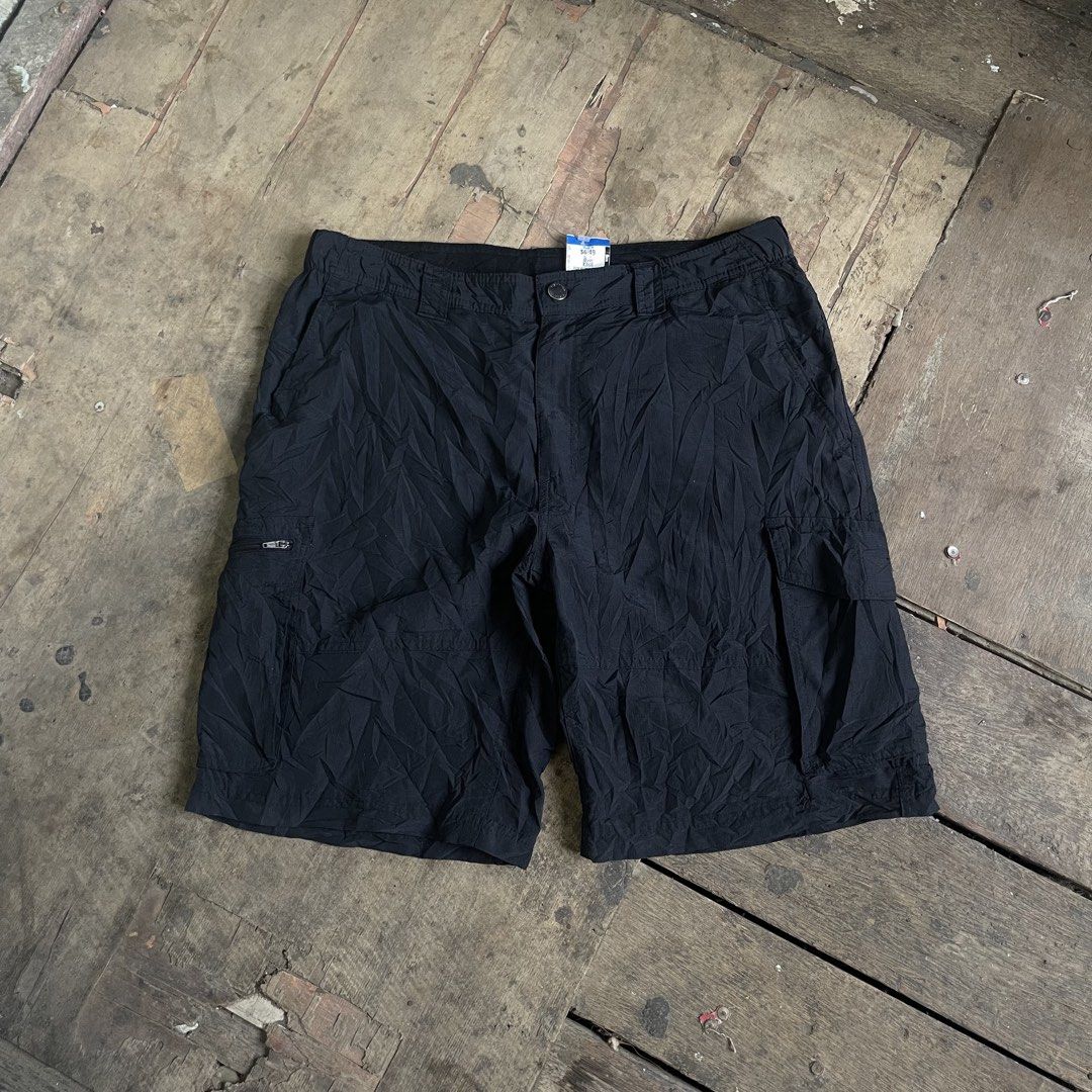 Columbia Black Cargo Shorts Size 34 (Category: Shorts) located in Manila. Submitted by bravebird_164362 (Listing ID 1465980599, Image 1). Description: - Brand/Model: Columbia Cargo Shorts - Color: Solid Black - Size: Tagged Size 34 - Material: Lightweight nylon and polyester blend - Storage: Multiple utility pockets with secure zipper closures - Closure: Button and zip fly - Origin: Made in Bangladesh - Condition/Use: Practical everyday outdoor w