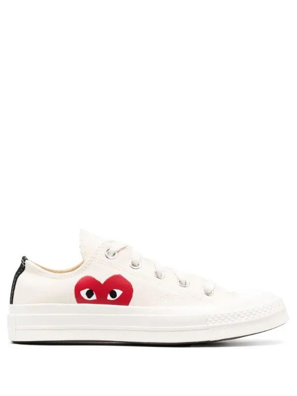 Comme des Garcons PLAY x Converse Chuck 70 Low White (Category: Sneakers) located in Nueva Valencia. Submitted by chinathrift__ (Listing ID 1466115037, Image 1). Description: - Brand: Comme des Garcons PLAY x Converse - Style: Low top canvas sneakers - Design: Iconic red heart logo with black eyes, contrast black heel stripe - Details: Classic Chuck 70 rubber toe cap, vulcanized sole, silver metal eyelets, white laces - Color: Clean off-white - C