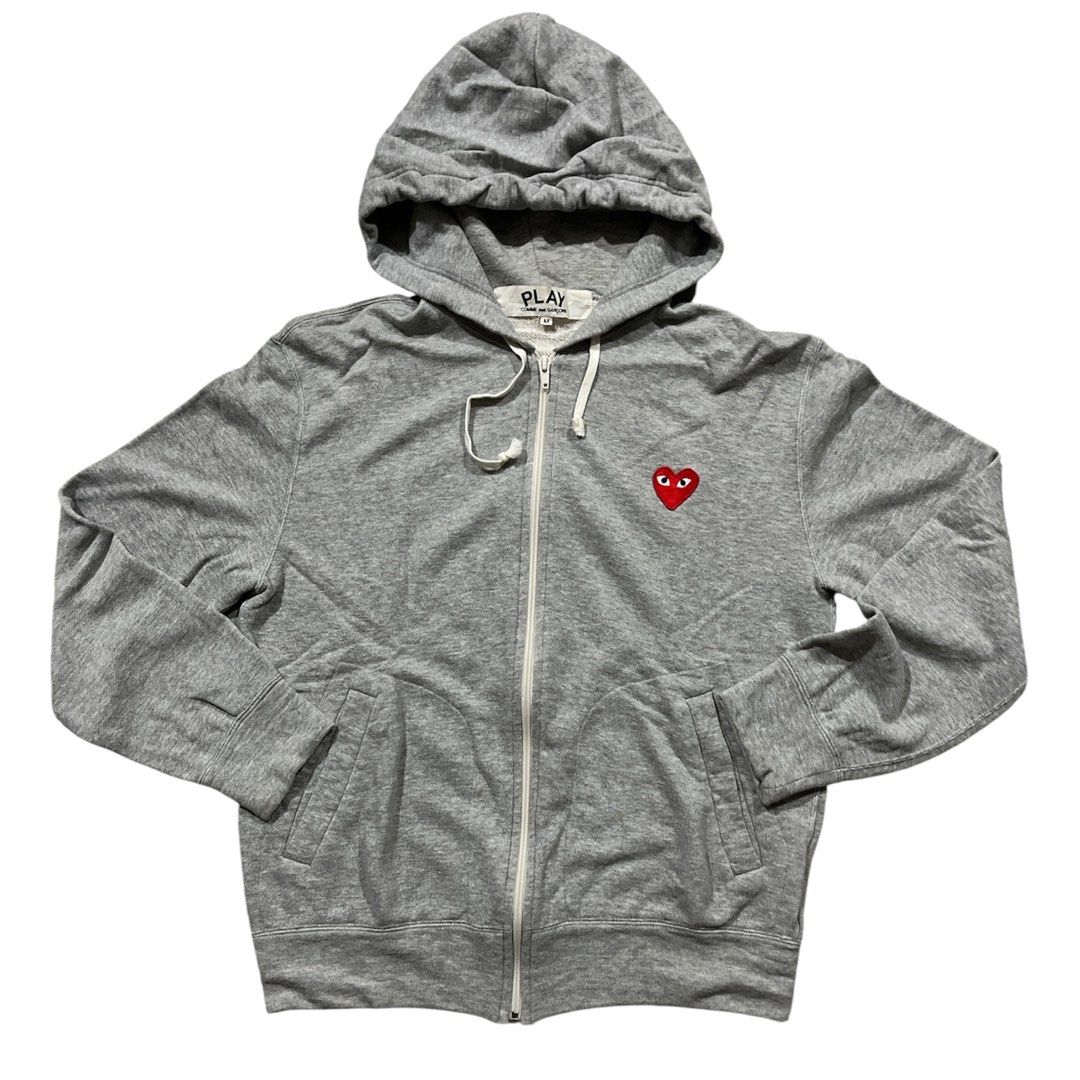 Comme Des Garcons Play Zip Up Hoodie (Category: Hoodies) located in Tubao. Submitted by elyu_grails (Listing ID 1466064365, Image 1). Description: Comme Des Garcons Play Zip Up Hoodie Almond Eye Heart Featuringthe brand’s signature embroidered red heart logo on the chest. Size Medium on tag Dimes 21x25.5 Excellent condition No major issues 1190+sf Feel free to negotiate 👌🏽.