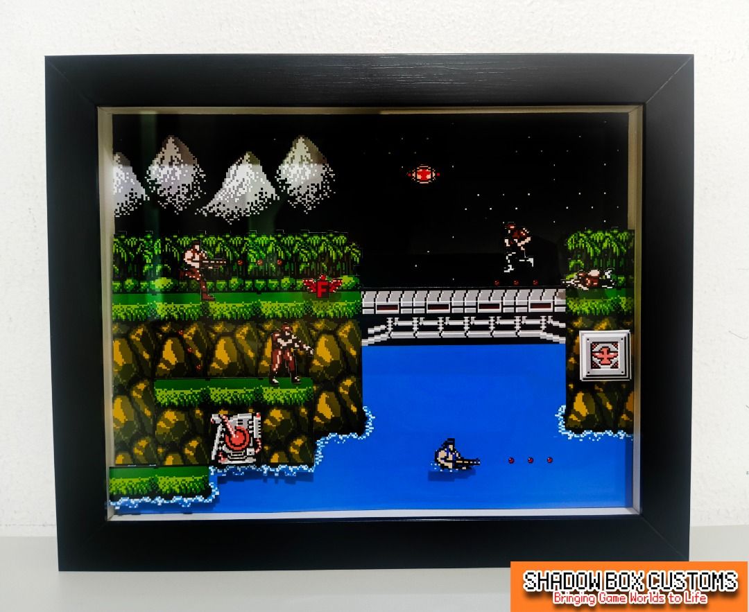 Contra Video Game Shadow Box (Category: Nintendo) located in Quezon City. Submitted by natzuki10 (Listing ID 1465969013, Image 2). Description: Contra Video Game Shadow Box Height: 10 inches Width: 8 inches *Handmade Pixel Shadow Boxes *Accepting Customized Designs *Perfect for Gamers & Collectors #giftideas #roomdecor #videogame #retrogame.