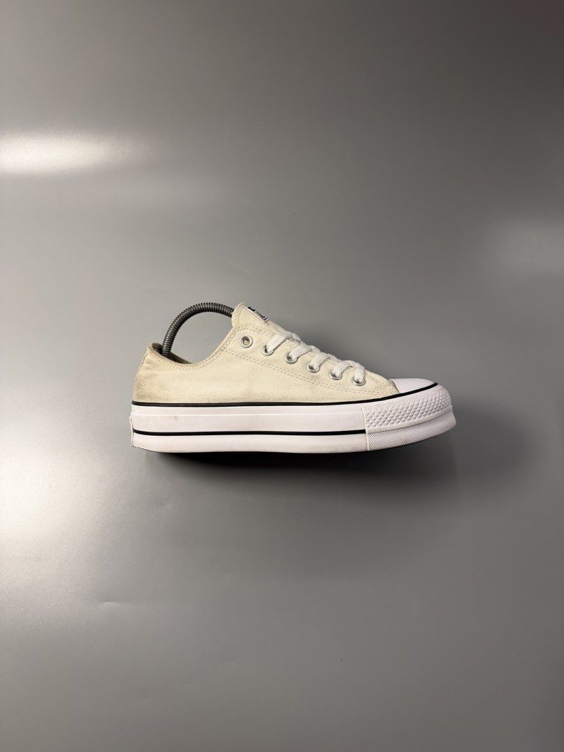 Converse All Star Platform Low Top Cream (Category: Sneakers) located in Caloocan City. Submitted by maempenafi21452 (Listing ID 1466068771, Image 2). Description: - Brand: Converse All Star - Style: Low top platform sneakers - Color: Cream canvas with classic black stripes and white laces - Soles: Platform rubber sole with dark brown outsole - Condition: Pre-loved with slight canvas discoloration, normal heel wear, and minor dirt on soles - Deta