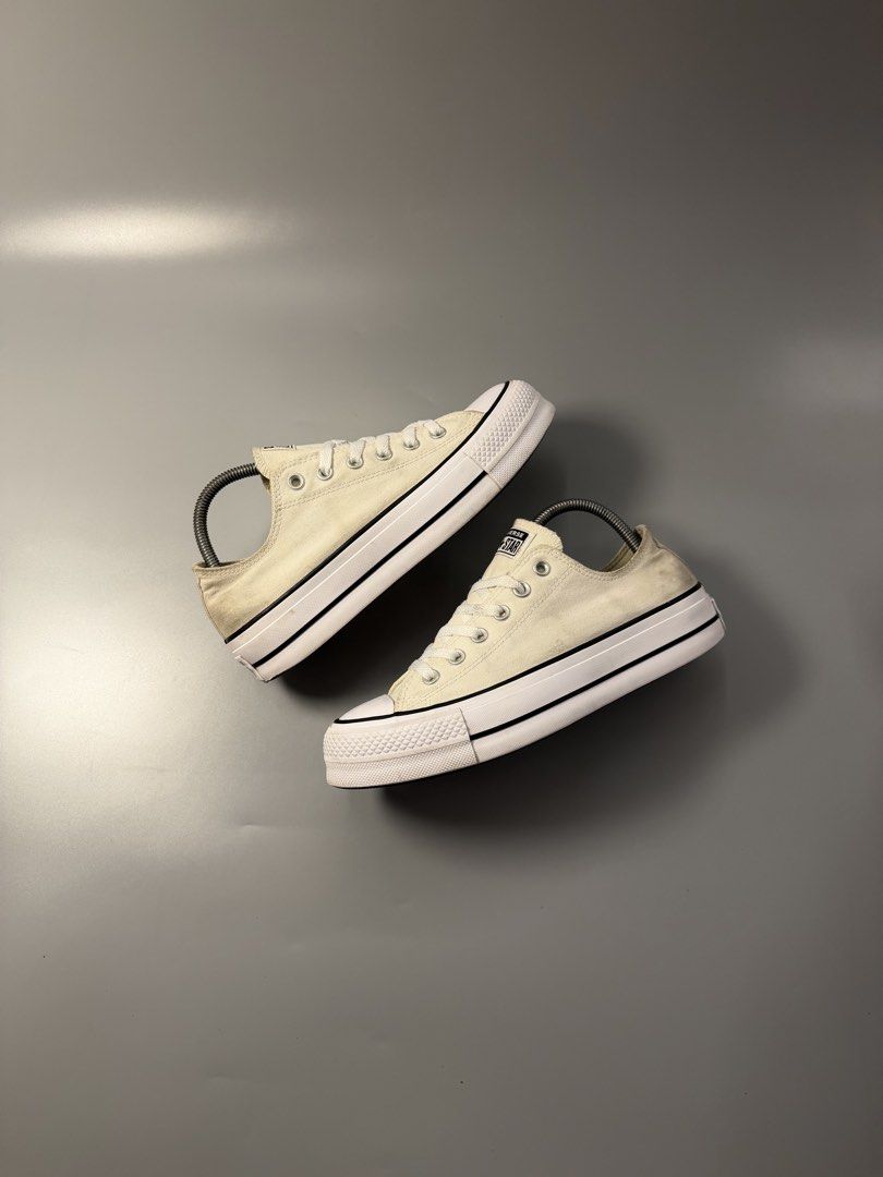Converse All Star Platform Low Top Sneakers Off White (Category: Sneakers) located in Quezon City. Submitted by markieexp (Listing ID 1466092825, Image 1). Description: - Brand: Converse - Style: Off-white canvas low-top sneakers with thick platform sole - Details: Black piping along the midsole, white laces with metal eyelets, and classic brown rubber waffle outsoles - Condition: Casual everyday shoes, well-maintained with plenty of wear left in