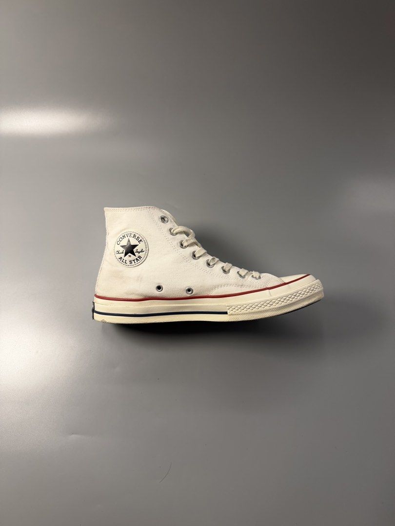 Converse Chuck 70 High Top Parchment White (Category: Sneakers) located in Caloocan City. Submitted by maempenafi21452 (Listing ID 1466068768, Image 2). Description: - Brand/Model: Converse Chuck 70 High Top - Color: Parchment White - Size: Men's 8 - Features: Classic vintage style, higher rubber foxing tape, cushioned OrthoLite insoles, contrast black heel patch, and star ankle patch - Origin: Made in Vietnam - Condition: Minor wear on soles and