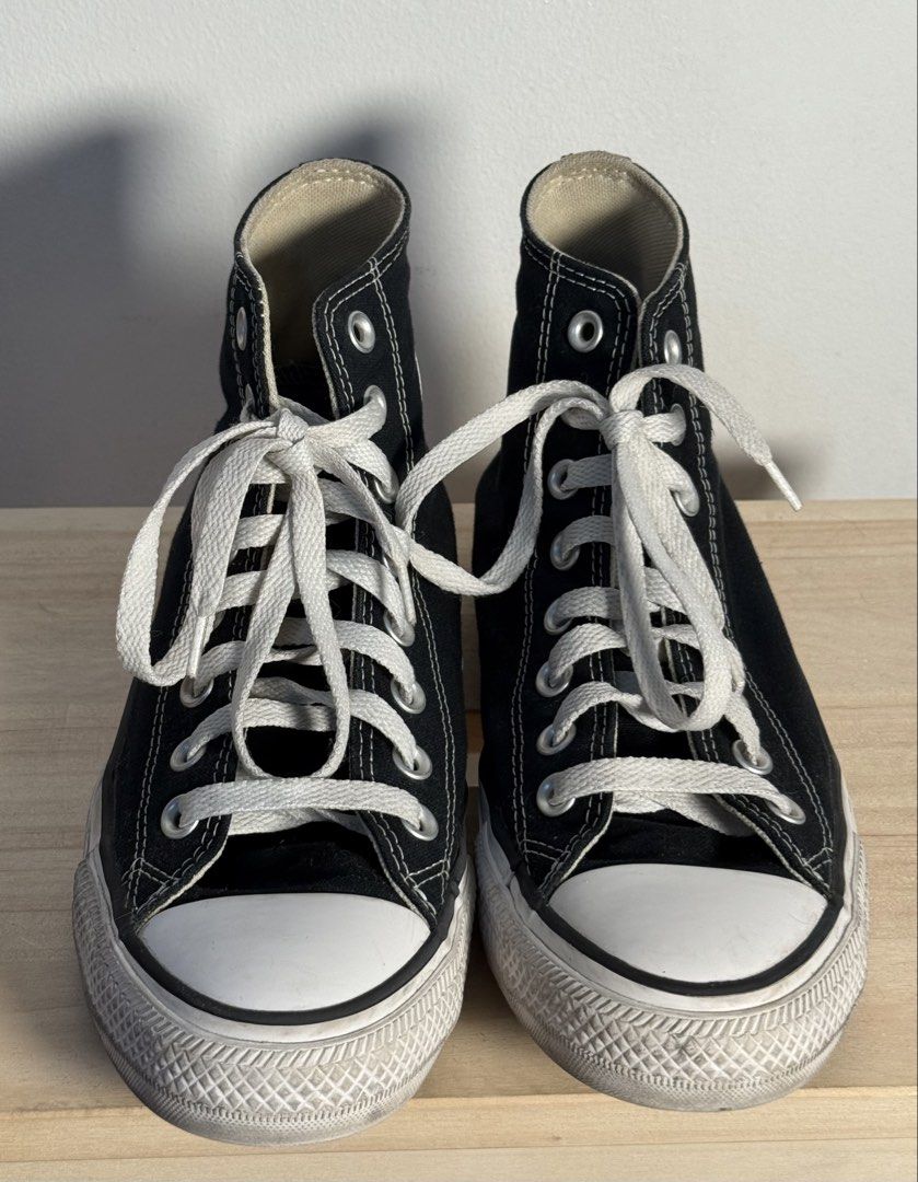 Converse Chuck Taylor All Star High Top Black (Category: Sneakers) located in Pasig City. Submitted by meowstuff_ (Listing ID 1466073575, Image 2). Description: - Classic black high top sneakers from Converse. - White laces and toe caps. - Rubber soles with minor dirt marks around the edges from normal wear. - Fabric uppers intact and clean. - Great everyday kicks that go with almost any casual outfit, feet does not hurt wearing these. - Size: Me