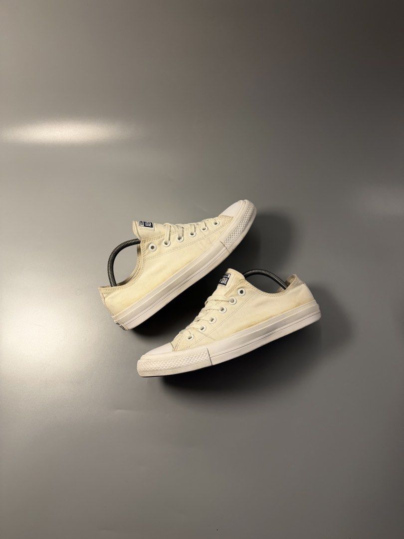 Converse Chuck Taylor All Star Low Top White (Category: Sneakers) located in Quezon City. Submitted by markieexp (Listing ID 1466092827, Image 1). Description: Classic white Converse Chuck Taylor low top sneakers. Men size 8, Women size 10, EUR 41.5. Canvas upper with rubber toe cap and brown rubber outsole. Standard lace-up design with metal eyelets. Made in Vietnam. Noticeable yellowing and minor scuffs on the fabric and soles from regular wear