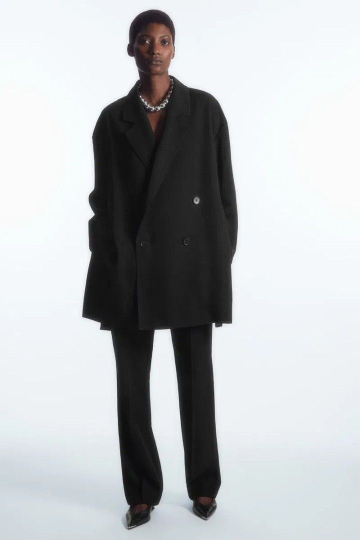 COS Oversized Draped Double-Breasted Blazer in black (Category: Coats, Jackets and Outerwear) located in Taguig. Submitted by nextflip (Listing ID 1466013280, Image 2). Description: in excellent condition w28 x L32.5 sleeve length 22.