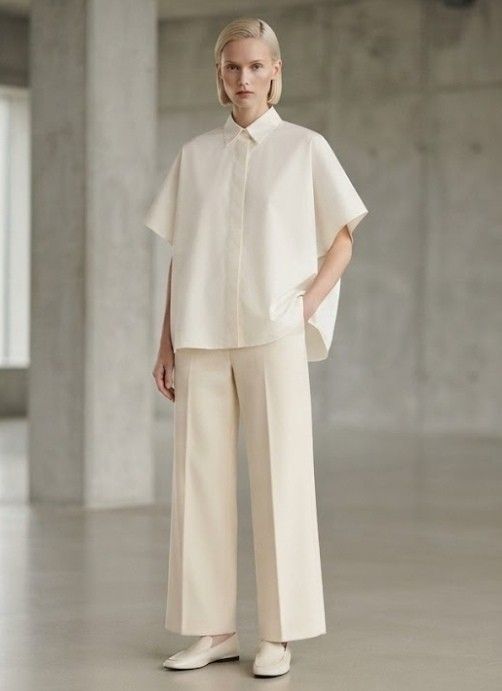 Cream Boxy Short Sleeve Button-Up Shirt (Category: Shirts) located in Donsol. Submitted by saksthriftavenuebyluckymaria8 (Listing ID 1466093767, Image 1). Description: - Color: Cream (neutral tone) - Design: Classic collar with concealed button placket - Sleeves: Short, wide sleeves - Fit: Relaxed and boxy through the body - Style: Clean, minimalist look - Versatility: Easy to pair with wide-leg trousers or denim chest 38in length 24in .