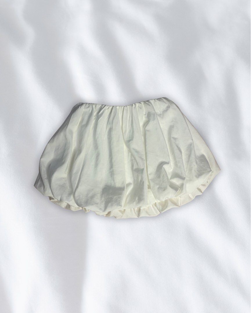 Cream Bubble Shorts 🤍 Cute/Trendy (Category: Skirts) located in Roxas City. Submitted by mariellaann_ (Listing ID 1466000195, Image 1). Description: - Color: White - Silhouette: Puffy bubble balloon style with layered hem for extra volume - Waist: High waist with comfortable gathered elastic - Material: Lightweight and easy to wear all day - Styling: Perfect to pair with oversized sweaters or simple baby tees.