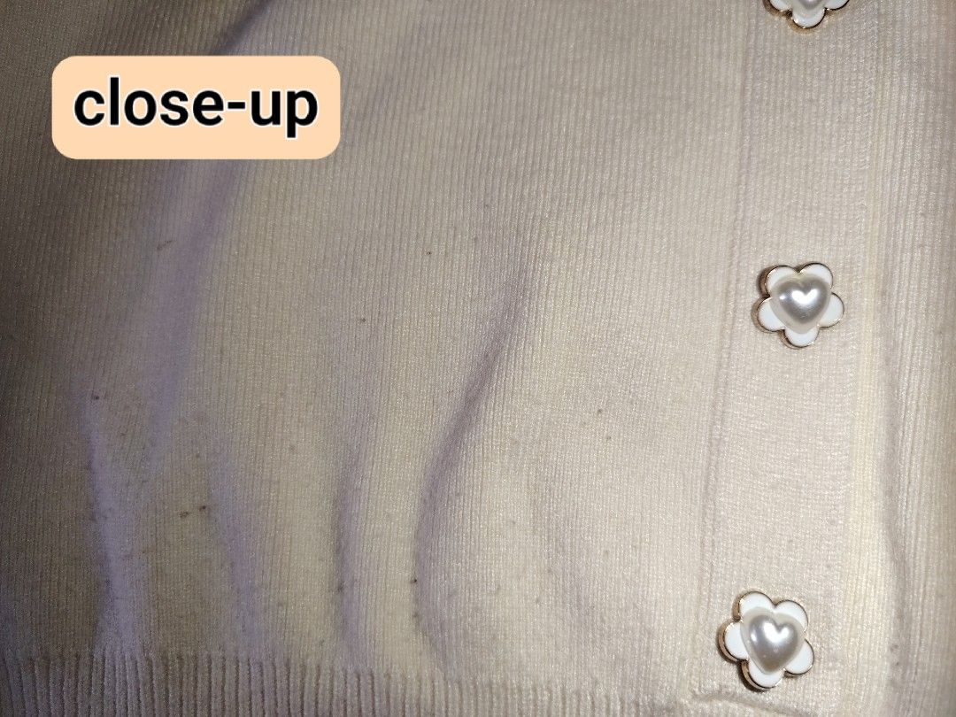 Cream Collared Knitted Sweater With Flower Buttons (Category: Longsleeves) located in Tarlac. Submitted by your_finds (Listing ID 1465998175, Image 3). Description: Description: - S-M ang size - Color cream - Design lang ang buttons Condition: 8/10 / Good condition Issue: Himulmol at stain Medida size (inch) Bust: 34-37 Length: 18.5.