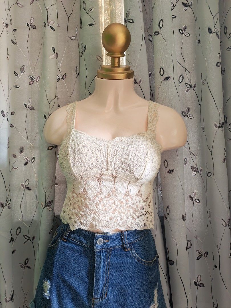 Cream Lace Crop Top Camisole Bustier (Category: Sleeveless) located in Caloocan City. Submitted by _misskaye (Listing ID 1465962443, Image 1). Description: - Cream lace crop top with a sheer floral pattern - Sweetheart neckline with structured cups - Thick straps and flattering scalloped hem - Soft, slightly stretchy fabric for comfort - Great for warm weather or layering with high-waisted bottoms -Small to Medium.