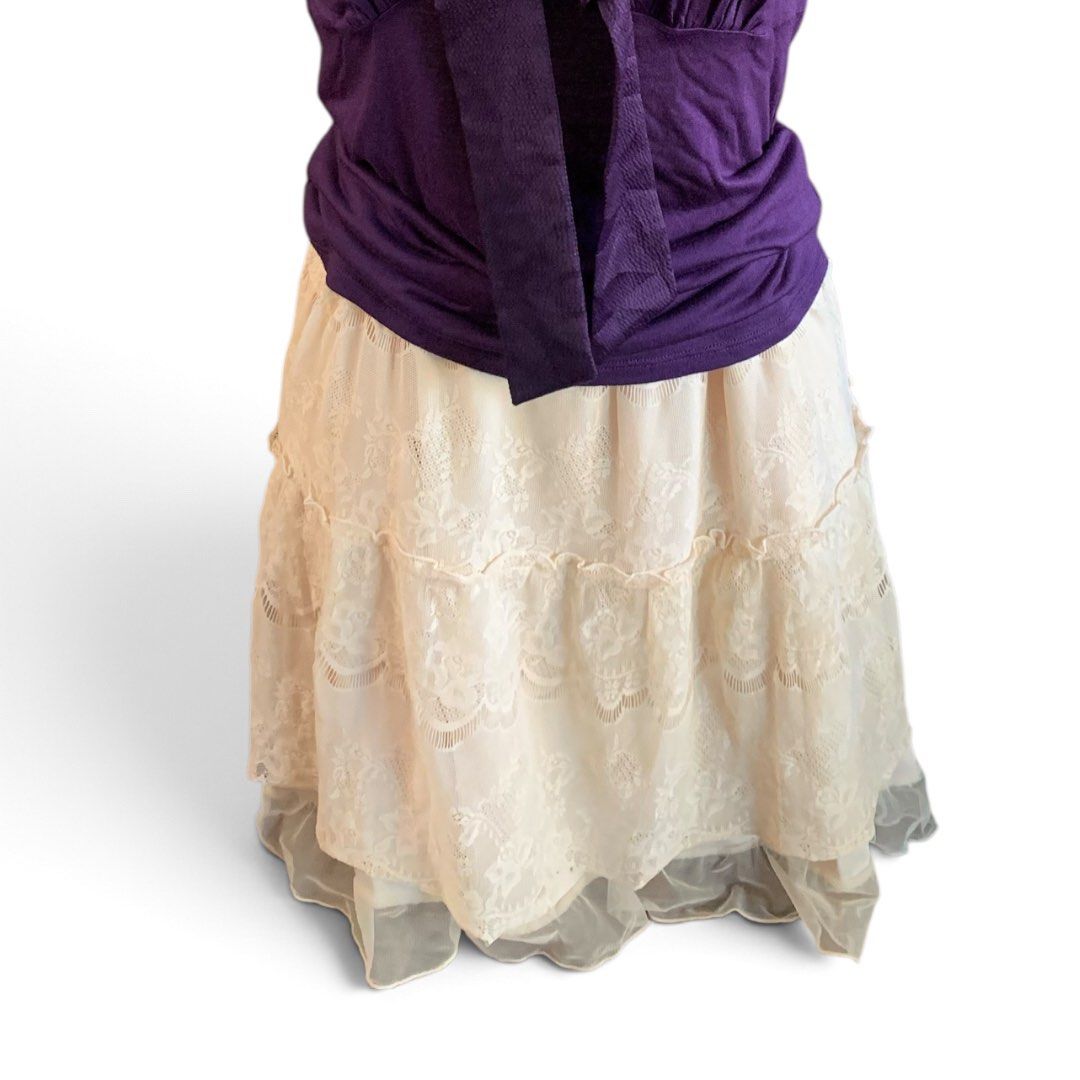 Cream Lace Tiered Mini Skirt (Category: Skirts) located in Manila. Submitted by thriftnivee (Listing ID 1466028947, Image 2). Description: - Color: Cream - Material: Delicate floral lace with sheer tulle ruffle hem - Waistband: Comfy matching satin elastic waistband for an easy fit - Design: Tiered layers with extra volume at the bottom - Styling: Perfect for layering with boots and cozy tops - Condition: Brand new / Excellent - Mode of Payment: 