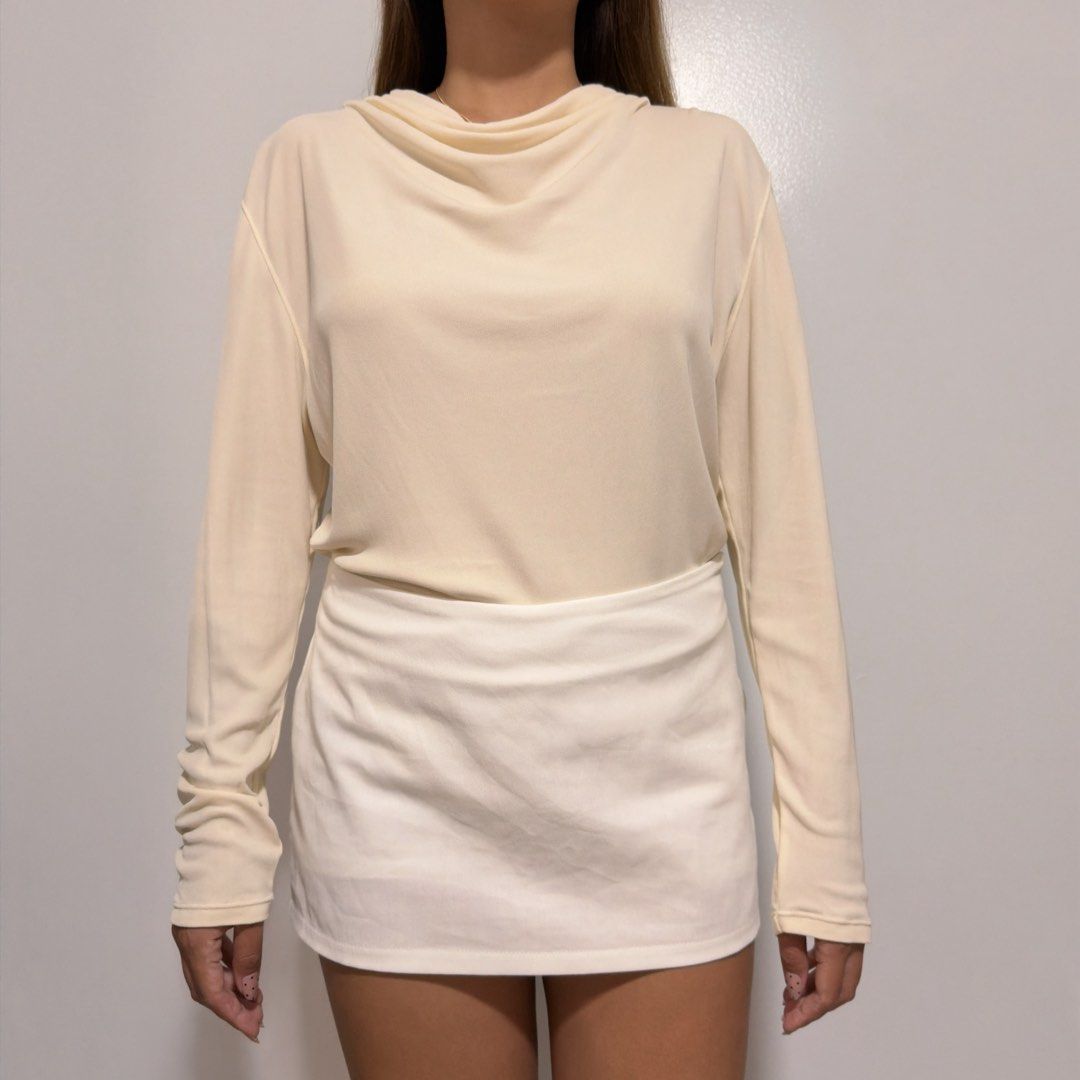 cream long sleeve top (Category: Longsleeves) located in Cebu City. Submitted by cuteoncue (Listing ID 1466153172, Image 1). Description: large-xl (large on tag) please see last photo for washable stains and minor pinholes. the item was freshly laundered but not soaked or stain-treated..