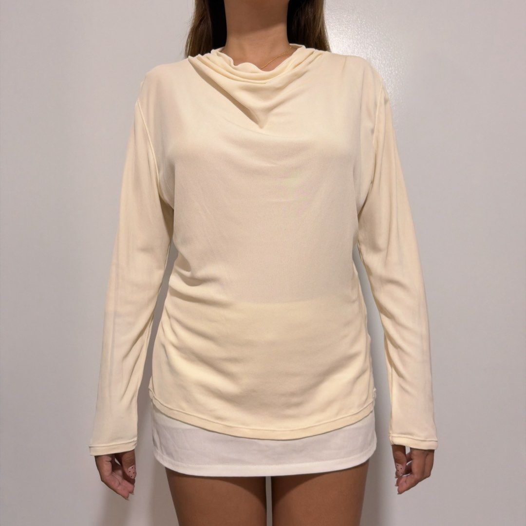 cream long sleeve top (Category: Longsleeves) located in Cebu City. Submitted by cuteoncue (Listing ID 1466153172, Image 3). Description: large-xl (large on tag) please see last photo for washable stains and minor pinholes. the item was freshly laundered but not soaked or stain-treated..