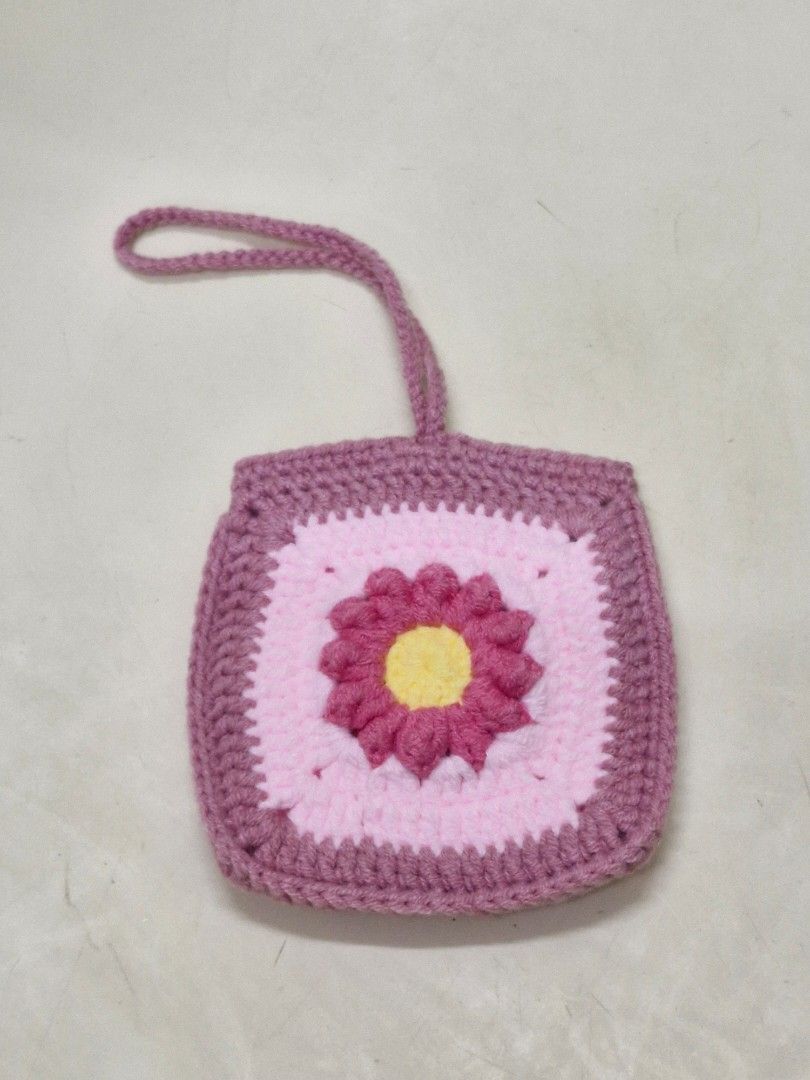 Crochet Granny Square Flower Bag Charm Pouch (Category: Handmade Craft) located in Paranaque City. Submitted by mi_artesano_mnl (Listing ID 1466029599, Image 3). Description: Handmade Crochet Granny Square Bag Charm Pouch 🌼 Cute and useful little pouch that you can attach to your bag! 💕 ✨ Handmade crochet ✨ Granny square design ✨ Perfect for coins, earphones, small essentials or little keepsakes ✨ Can also be used as a cute bag charm ✨ Great fo
