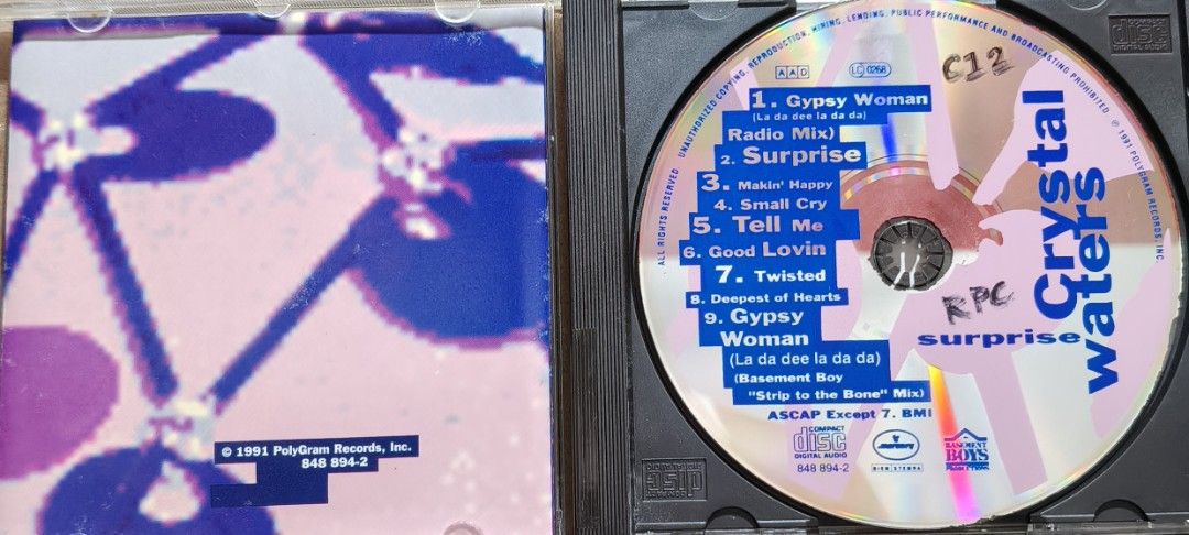 Crystal Waters Surprise Audio CD (Category: CDs & DVDs) located in Manila. Submitted by ruelcabrer77078 (Listing ID 1466137995, Image 3). Description: - Title: Crystal Waters Surprise Audio CD - Format: Standard plastic jewel case with spine - Artwork: Blue and purple tones featuring the artist's face on the front cover - Condition (Case): Minor scuffs and surface wear from storage - Condition (Disc): Plays fine and tested.