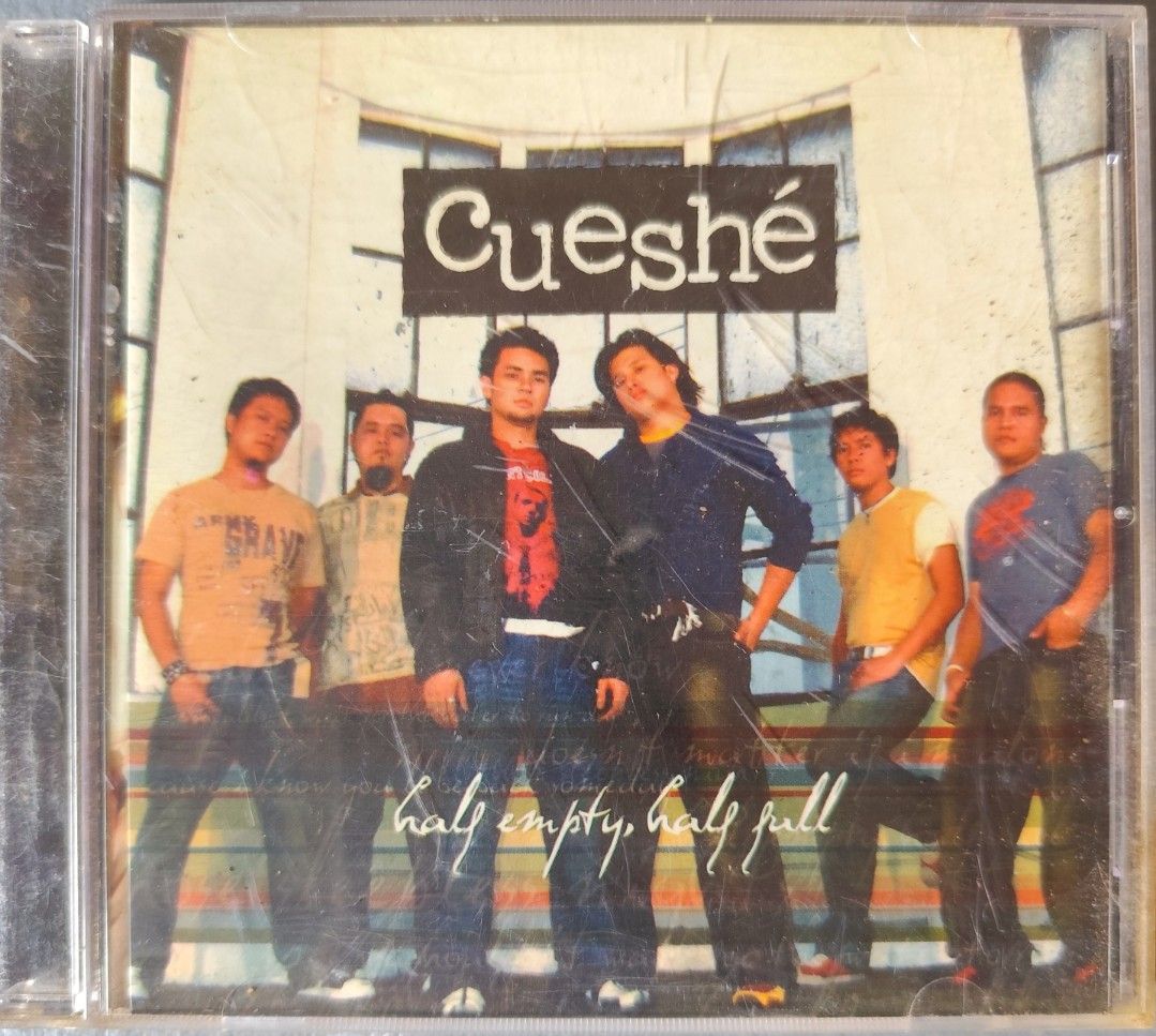 Cueshé Half Empty Half Full Audio CD (Category: CDs & DVDs) located in Valenzuela. Submitted by xjepsx (Listing ID 1465990632, Image 1). Description: - Artist & Album: Cueshé - Half Empty, Half Full - Format: Original OPM release in standard jewel case - Artwork: Features all 6 band members on the front cover - Condition: Plastic case has light storage scratches; disc is tested and plays fine - Perfect addition to any classic Pinoy rock and local