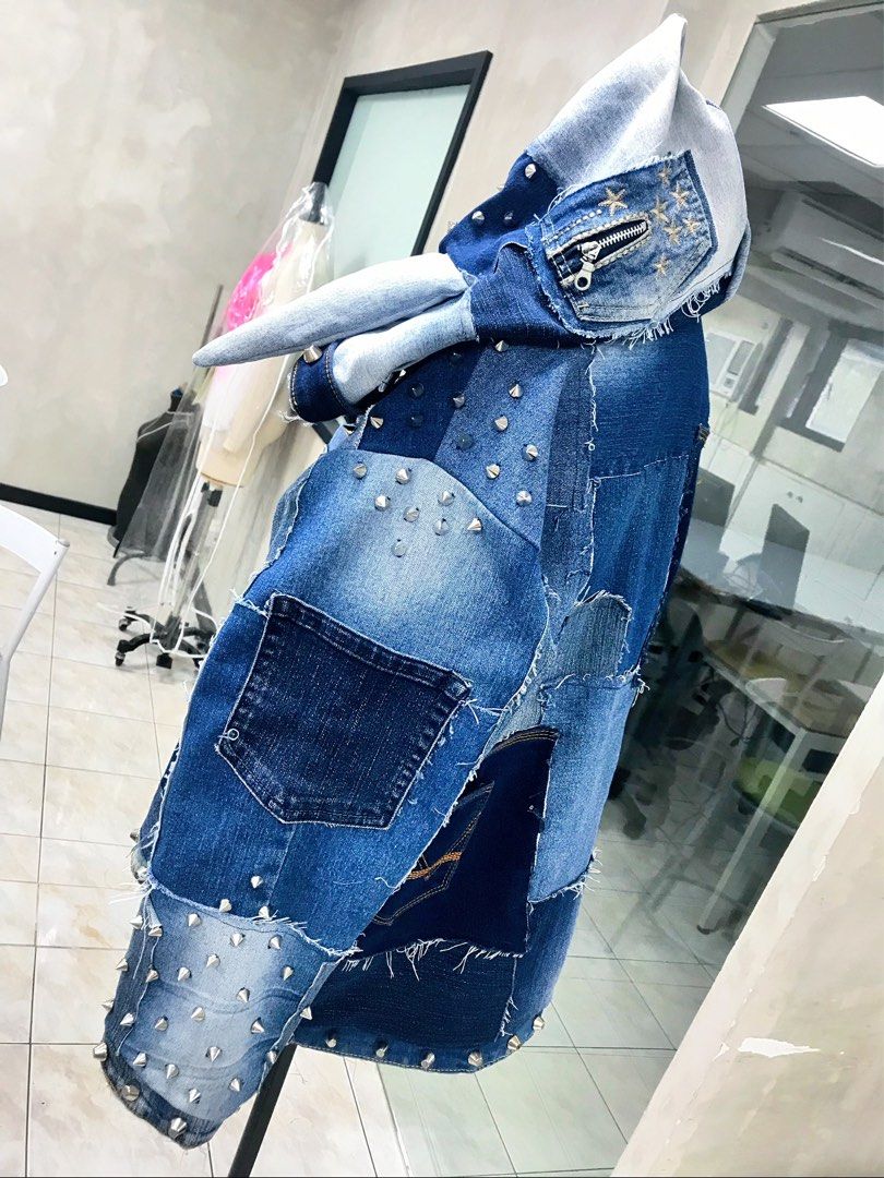 Custom Studded Denim Patchwork Jacket with Hood and Horns (Category: Coats, Jackets and Outerwear) located in Taguig. Submitted by aphroditexelliz08 (Listing ID 1466135616, Image 2). Description: • Custom Designer made heavy denim jacket with a unique patchwork design • Features metal spike studs along the sleeves, hood, and hem • Built-in hood includes two fabric bunny ears and a small zipped pocket detail • Accented with multiple mismatched den