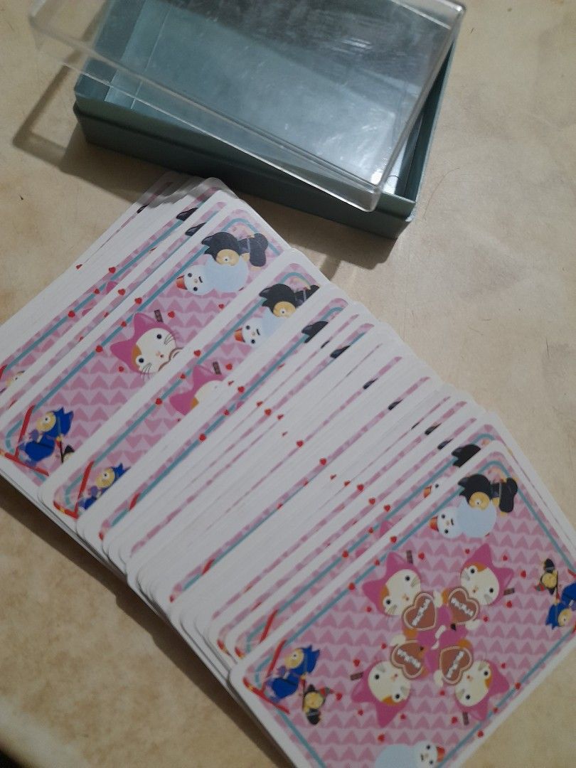 Cute Cat and Winter Graphic Playing Cards with Case (Category: Board Games & Puzzles) located in Bocaue. Submitted by marajapansurplus (Listing ID 1466072532, Image 1). Description: - Custom deck of playing cards featuring unique cat, snowman, and Japanese character art on every face - Standard card size, perfect for regular card games or as a collector's item - Comes with the original clear plastic storage case for safekeeping - Fun and quirky d